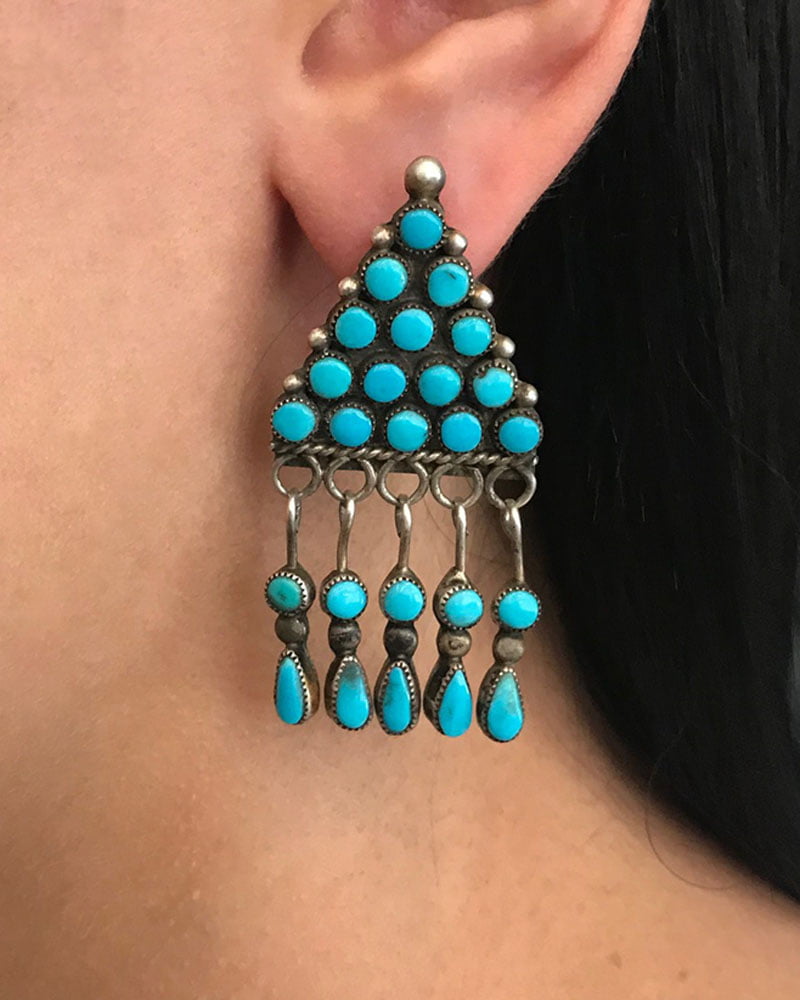 The Beautiful Navajo Turquoise Earrings are a  design for rain clouds.  They are beautifully crafted with consistent Sleeping Beauty Turquoise.